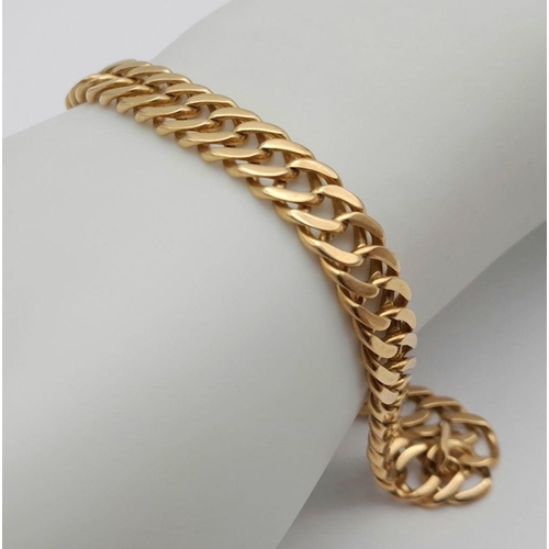 169 - AN 18K GOLD INTERLINK 24cms BRACELET .   28.2gms