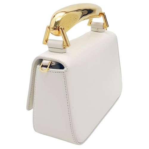 17 - A Tom Ford White Bianca Bag. Leather exterior with gold-toned hardware, handle and magnetic closure.... 