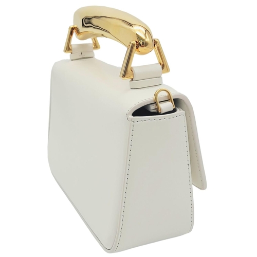 17 - A Tom Ford White Bianca Bag. Leather exterior with gold-toned hardware, handle and magnetic closure.... 