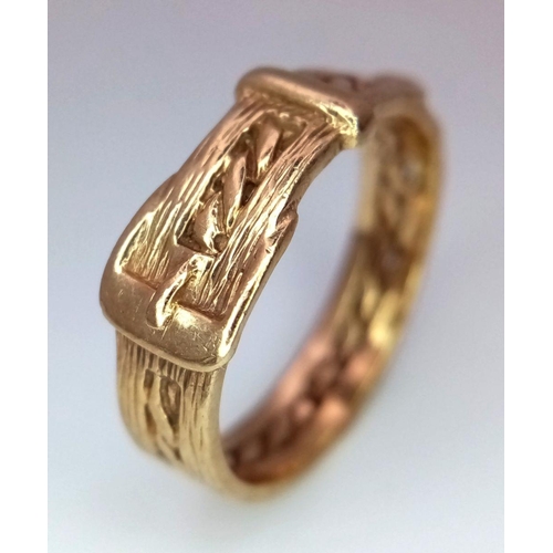 284 - A 9K GOLD RING IN THE SHAPE OF A BELT WITH BUCKLE .   3.4gms   size Q