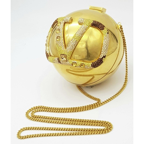 67 - A Valentino Gold Orb Clutch Bag. Metal exterior with a stone embellished V logo and clasp fastening ... 