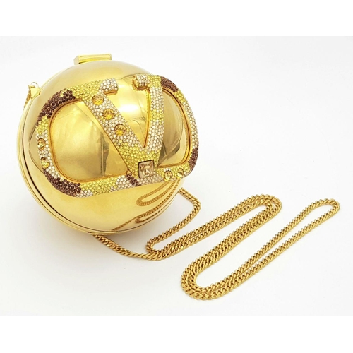 67 - A Valentino Gold Orb Clutch Bag. Metal exterior with a stone embellished V logo and clasp fastening ... 