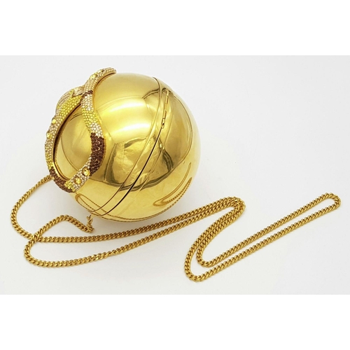 67 - A Valentino Gold Orb Clutch Bag. Metal exterior with a stone embellished V logo and clasp fastening ... 