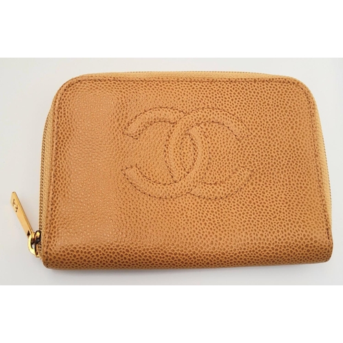74 - A Chanel Beige CC Timeless Shoulder Bag and a Chanel Purse. Both items feature a luxurious caviar le... 