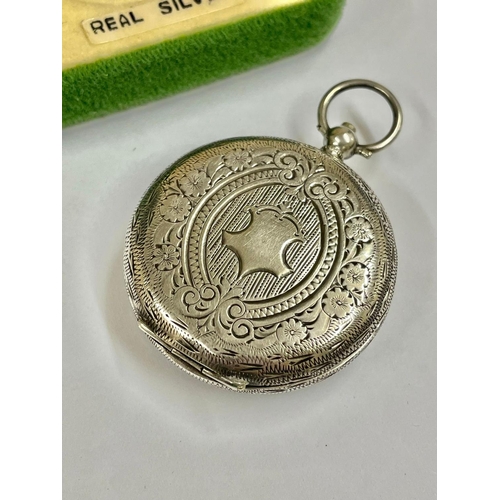 279 - An Antique ladies silver pocket watch , ticks when shaken . Sold as found .