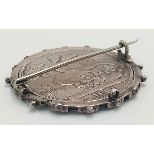 119 - 1821 GEORGE IV SILVER CROWN in Very Fine condition. Mounted in a SILVER cartwheel BROOCH/PENDANT.