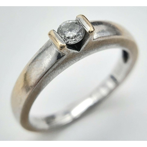 126 - A subtle and understated 18 carat WHITE GOLD and DIAMOND SOLITAIRE RING. Full UK hallmark. 4 grams. ... 