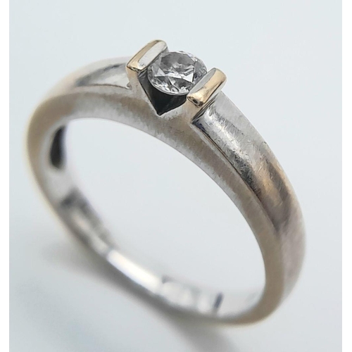 126 - A subtle and understated 18 carat WHITE GOLD and DIAMOND SOLITAIRE RING. Full UK hallmark. 4 grams. ... 