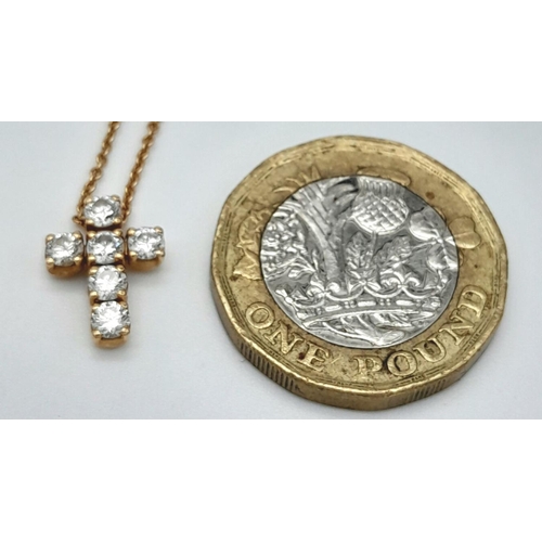 137 - A Six Stone Diamond Cross Pendant on an 18K Yellow Gold Necklace. 0.56ctw diamonds. 1cm and 42cm. 3.... 