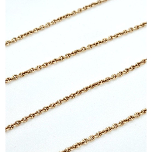 137 - A Six Stone Diamond Cross Pendant on an 18K Yellow Gold Necklace. 0.56ctw diamonds. 1cm and 42cm. 3.... 