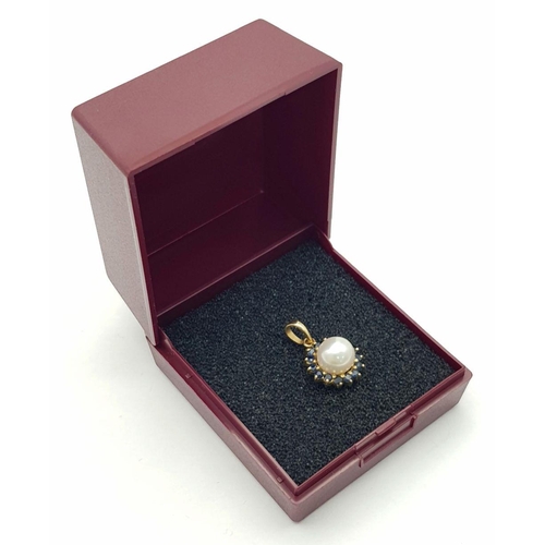 147 - Classic 14 carat GOLD PENDANT, set with PEARL and SAPPHIRES. 1.8 cm drop.