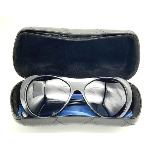 256 - A Pair of Classic Chanel Sunglasses with Case. 017908