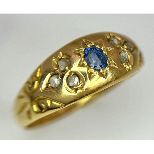 403 - AN ANTIQUE 18K GOLD RING SET WITH CENTRAL SAPPHIRE AND SIX SMALL DIAMONDS  .    2.0gms   size P/Q