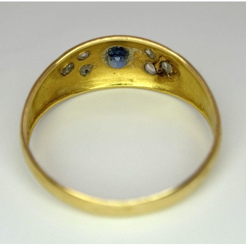 403 - AN ANTIQUE 18K GOLD RING SET WITH CENTRAL SAPPHIRE AND SIX SMALL DIAMONDS  .    2.0gms   size P/Q