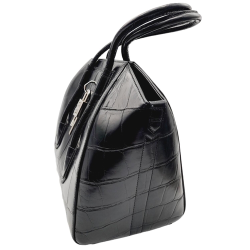 165 - A Givenchy Antigona Hand/Shoulder bag. Croc embossed black leather exterior and silver tone lock dec... 