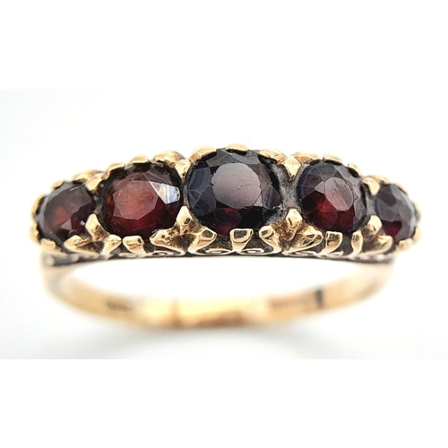 238 - Vintage 9 carat GOLD and GARNET RING. Consisting a sweep of 5 graduated Round Cut GARNETS  set to to... 