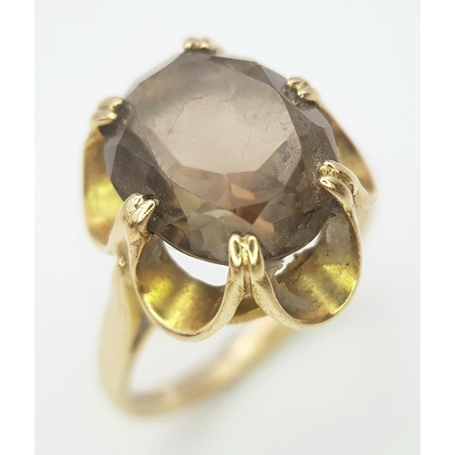 245 - Vintage 9 CARAT GOLD and BROWN AMETHYST RING. Consisting a large (3 carat) oval cushion cut BROWN AM... 