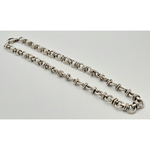 329 - SILVER CHUNKY DESIGNER LINK NECKLACE. Having circular links with SILVER Spacers.  54 grams. 42 cm.