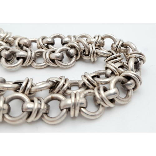 329 - SILVER CHUNKY DESIGNER LINK NECKLACE. Having circular links with SILVER Spacers.  54 grams. 42 cm.