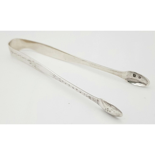 399 - Pair of antique George III SILVER TONGS. Hallmark for Thomas Northcote, London circa 1780. Approx 31... 