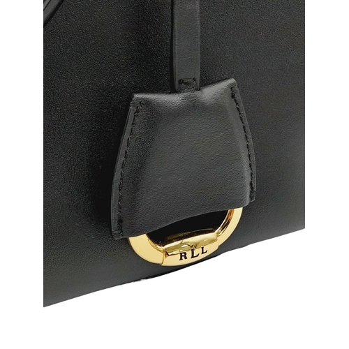 451 - A Ralph Lauren Black Leather Hand/Shoulder Bag. Gold tone hardware. Red leather interior with zipped... 