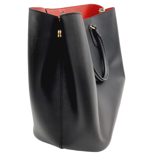 451 - A Ralph Lauren Black Leather Hand/Shoulder Bag. Gold tone hardware. Red leather interior with zipped... 