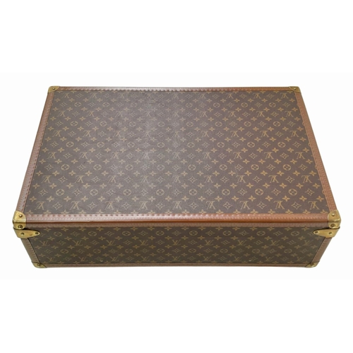 53 - A Vintage Louis Vuitton Trunk/Suitcase. Monogram canvas and brown leather trim exterior. Brass corne... 