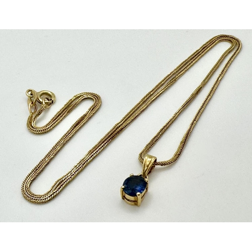 70 - An oval cut SAPPHIRE PENDANT set in 14 CARAT GOLD and mounted on a 14 CARAT GOLD BOX CHAIN NECKLACE.... 