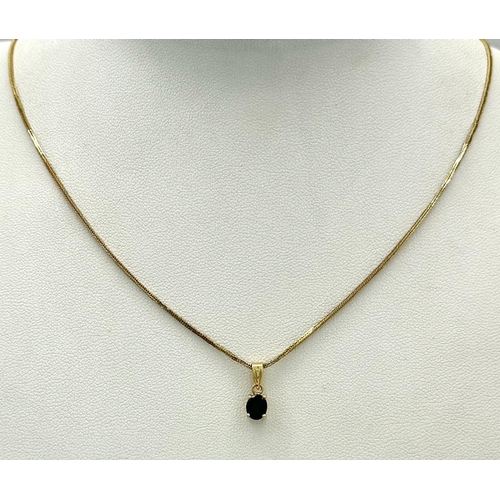 70 - An oval cut SAPPHIRE PENDANT set in 14 CARAT GOLD and mounted on a 14 CARAT GOLD BOX CHAIN NECKLACE.... 