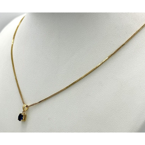 70 - An oval cut SAPPHIRE PENDANT set in 14 CARAT GOLD and mounted on a 14 CARAT GOLD BOX CHAIN NECKLACE.... 