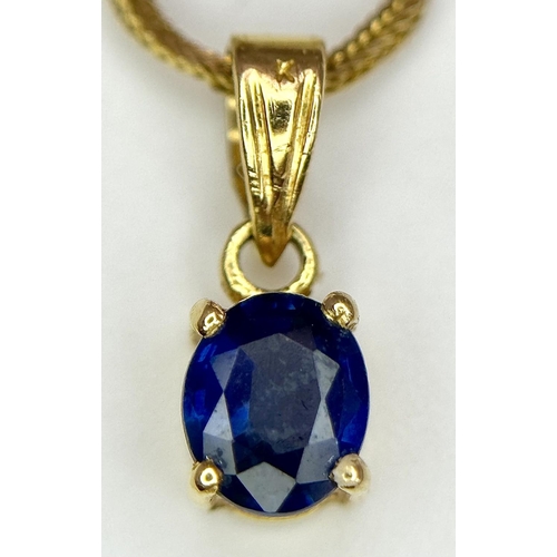 70 - An oval cut SAPPHIRE PENDANT set in 14 CARAT GOLD and mounted on a 14 CARAT GOLD BOX CHAIN NECKLACE.... 