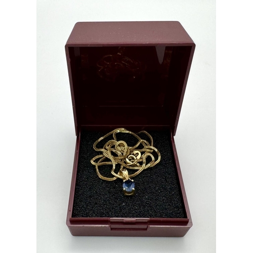 70 - An oval cut SAPPHIRE PENDANT set in 14 CARAT GOLD and mounted on a 14 CARAT GOLD BOX CHAIN NECKLACE.... 