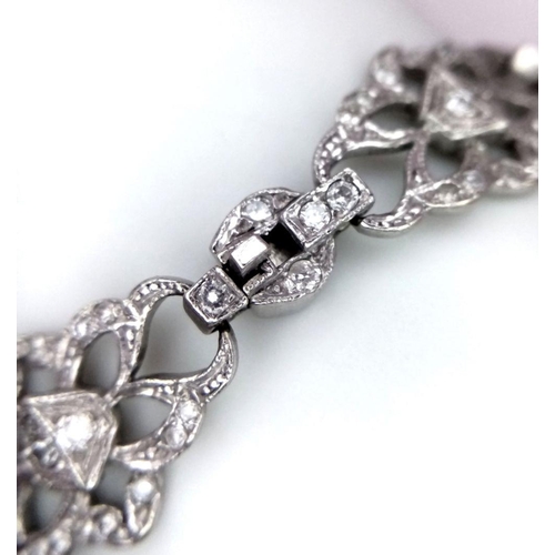 127 - An Art Deco Platinum and Diamond Bracelet. Old cut diamonds - 3ctw. 17.3g total weight. 18cm length.