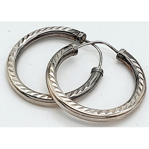 10 - A Pair of 9K White Gold Tubular Hoop Earrings. 3.7g