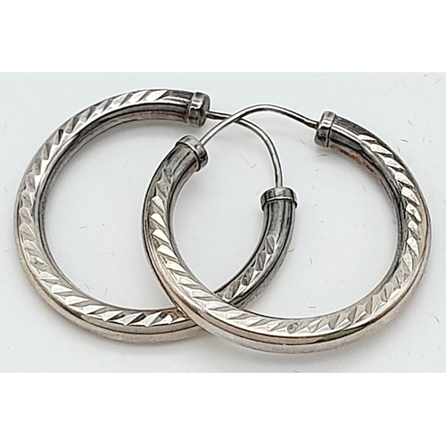 10 - A Pair of 9K White Gold Tubular Hoop Earrings. 3.7g