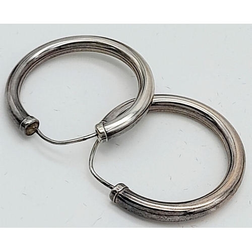 10 - A Pair of 9K White Gold Tubular Hoop Earrings. 3.7g