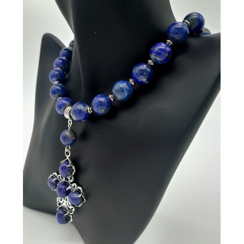 140 - A sterling silver and genuine lapis lazuli necklace and earrings set with large cross shaped pendant... 