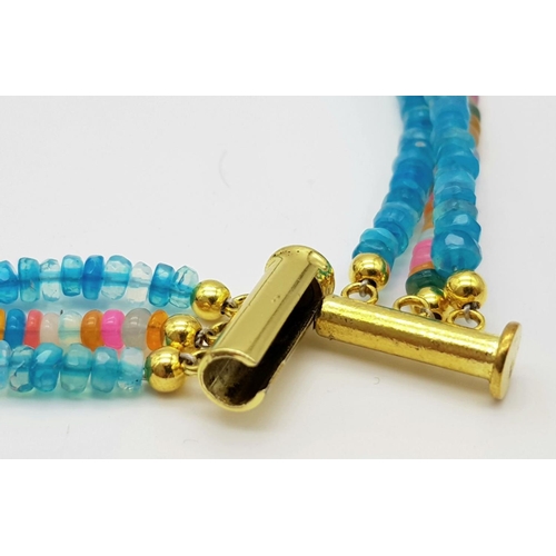 154 - A three-row necklace consisting of faceted opal beads predominantly with blue hues. Length: 43-48 cm... 