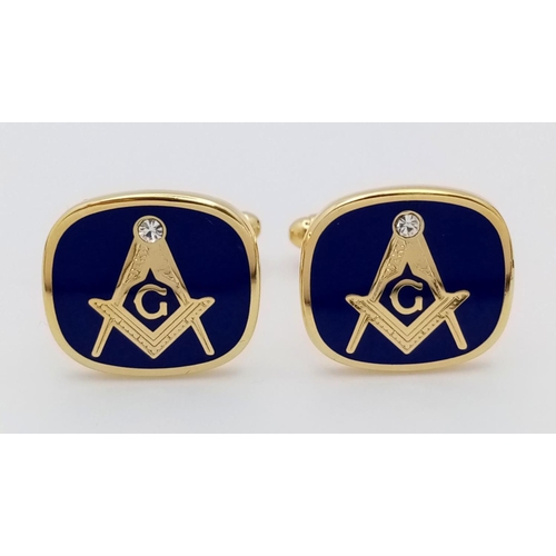 189 - Two items of Masonic interest: A very attractive pair of Masonic cufflinks, with the square and comp... 