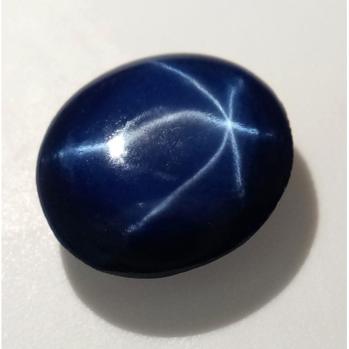 224 - A mesmerising, round/oval cabochon, six ray STAR SAPPHIRE, with a dark blue colouration. As sapphire... 