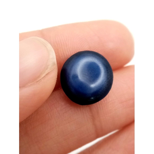 224 - A mesmerising, round/oval cabochon, six ray STAR SAPPHIRE, with a dark blue colouration. As sapphire... 