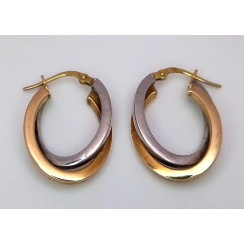 30 - A Pair of 9K Yellow and White Gold Oval Overlay Earrings. 1.9g