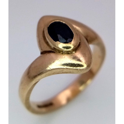 38 - A 9K Yellow Gold, Sapphire Crossover Ring. Size K. 3.8g