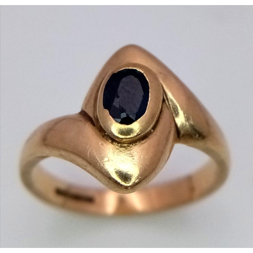 38 - A 9K Yellow Gold, Sapphire Crossover Ring. Size K. 3.8g