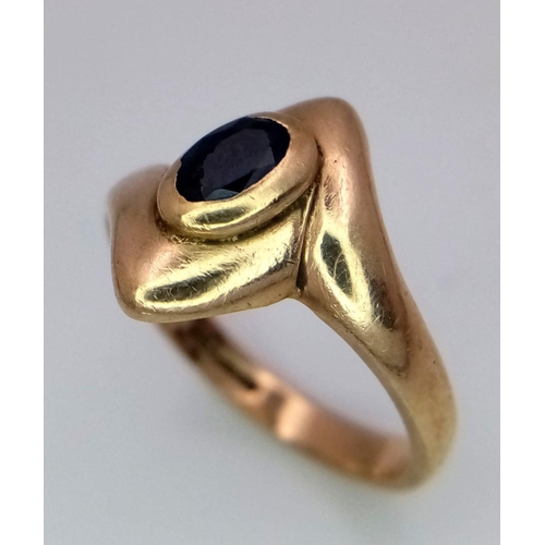 38 - A 9K Yellow Gold, Sapphire Crossover Ring. Size K. 3.8g