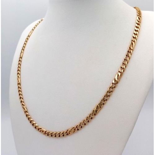 4 - A 14K Yellow Gold Flat Curb Link Chain. 46cm length. 26.7g