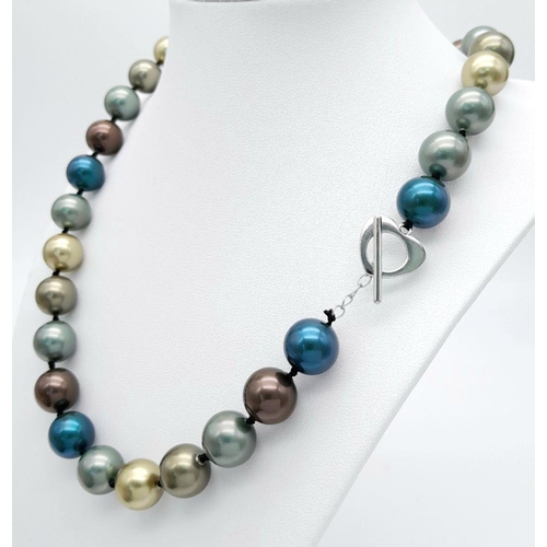 439 - A Dark Blue, Golds and Brown Coloured South Sea Pearl Shell Beaded Necklace. 12mm beads. 44cm neckla... 