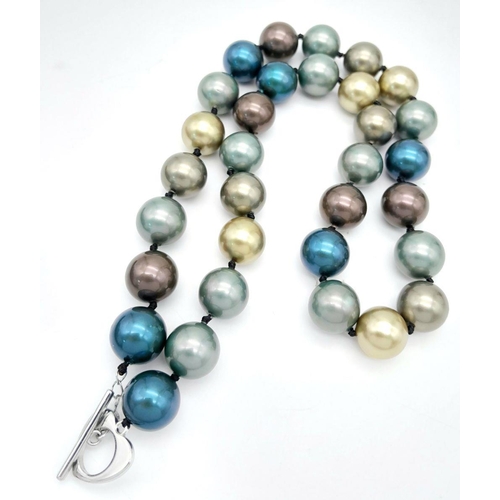 439 - A Dark Blue, Golds and Brown Coloured South Sea Pearl Shell Beaded Necklace. 12mm beads. 44cm neckla... 