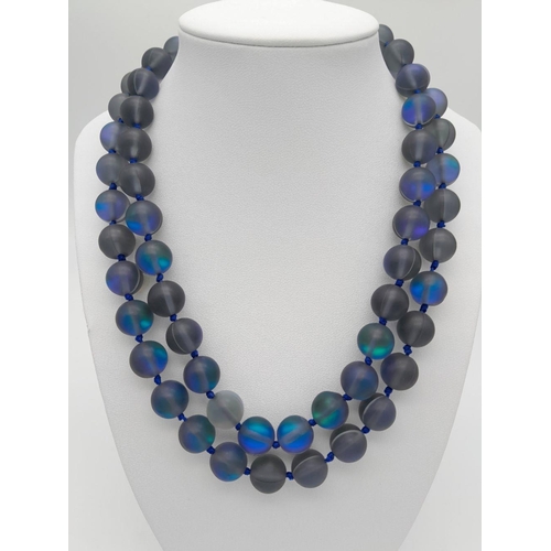 730 - An Electrifying Dark Grey Moonstone Matinee Length Necklace. 90cm in length with excellent colour-pl... 