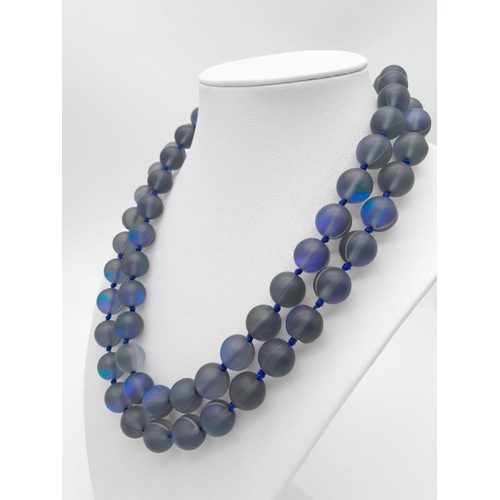 730 - An Electrifying Dark Grey Moonstone Matinee Length Necklace. 90cm in length with excellent colour-pl... 